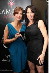 Teri Hatcher wearing the Diamonds by Donna Chocolate necklace and holding the Academy Award Inspired Signature Keepsake Series